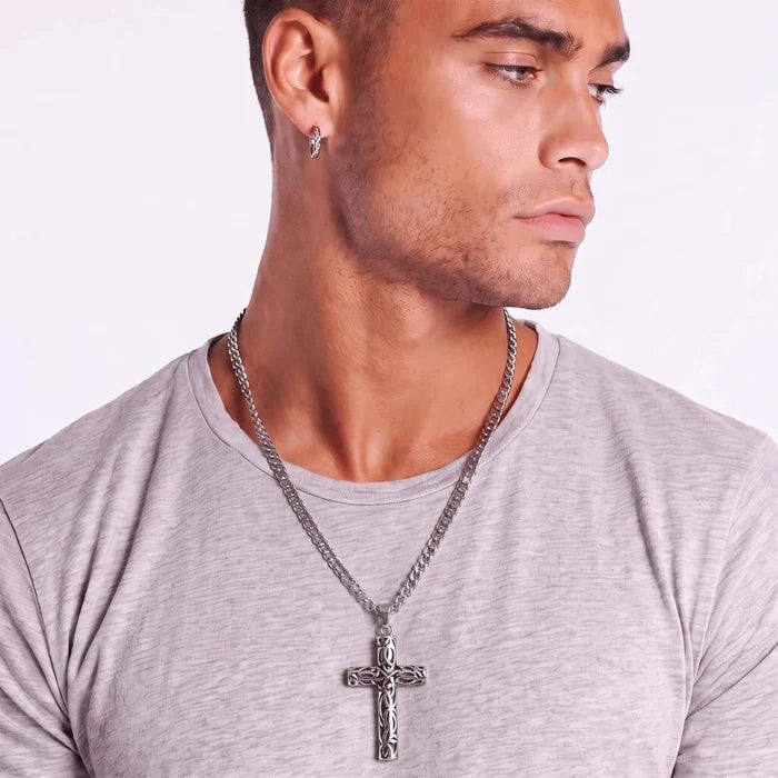 Celtic Cross Necklace in silver-tone metal with dark engraved detailing and a long chain, worn as a pendant