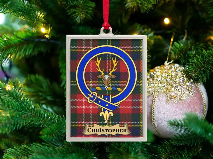 Christopher clan crest Christmas ornament in a silver frame on a tartan background