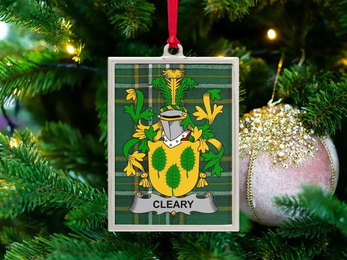Cleary Irish family crest Christmas ornament — crest on the Irish national tartan in a silver-tone frame