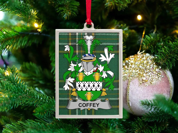 Coffey Irish family crest Christmas ornament — crest on the Irish national tartan in a silver-tone frame