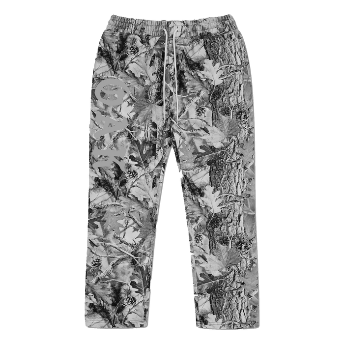 The Oaklandish Cork Pant is a loose-fitting, open-leg pant with an elastic waistband and drawstring, made from 100% cotton in Grey Wood Camo and finished with a large light graphic and stylized text on the left thigh.