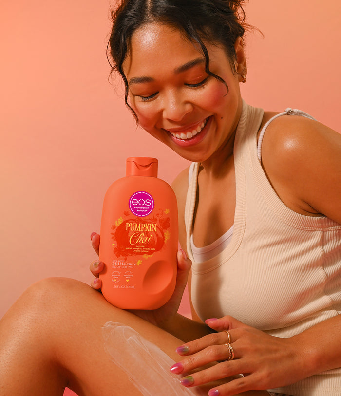 model applying body lotion pumpkin chai