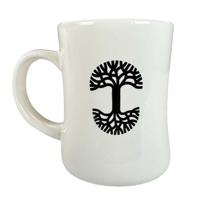 The Oaklandish Cranes Diner Mug is a 14 oz white ceramic mug featuring a black tree design with a symmetrical, kidney-shaped outline, shown from the side against a plain background—ideal for stylish drinkware collections.