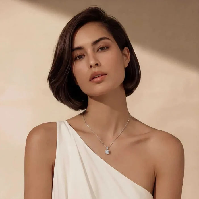 Crystal Clarity Clear-Stone Pendant Necklace with a fine silver chain and small round clear faceted pendant on a model