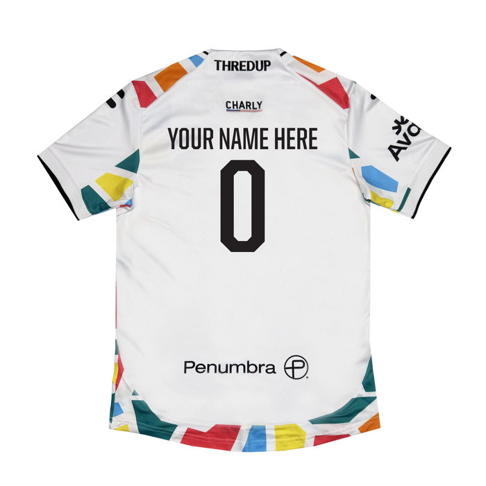 Back view of the Custom Unisex Mosaic in Motion Kit by Oakland Roots SC, featuring colorful geometric shapes on sleeves and hem, "YOUR NAME HERE" and 0 in bold black, plus sponsor logos (THREDUP, CHARLY, AVA, Penumbra) in black.