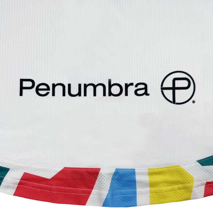 The Oakland Roots SC Custom Unisex Mosaic in Motion Kit is a white soccer jersey with "Penumbra," a black circular "P" logo, and a colorful geometric border inspired by the iconic Oakland Roots kit.