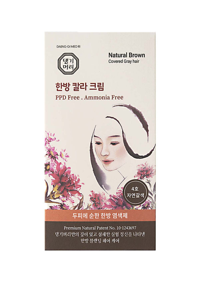 Product packaging for hair dye with a woman's face and floral design on a white background
