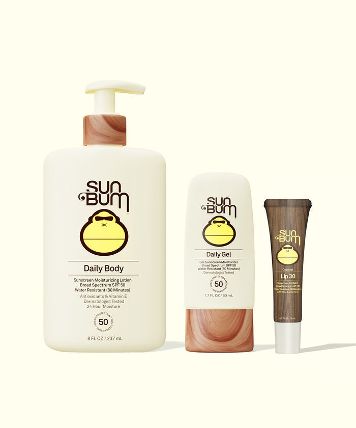 Sun Bum Daily + Lip Bundle showing SPF 50 Daily Body lotion, Daily Gel moisturizer, and Lip 30 balm with wooden accents