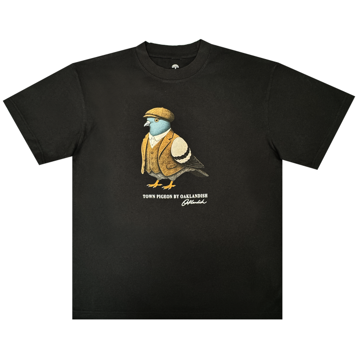Introducing the Dapper Tee from Oaklandish’s men’s collection—a black classic fit t-shirt showcasing a graphic of a pigeon dressed in a brown flat cap and vest. Underneath the illustration, “TOWN PIGEON BY OAKLANDISH” is printed in white text with a distinctive signature-like flourish below. Crafted from heavy-weight cotton, this standout tee is set against a plain white background.
