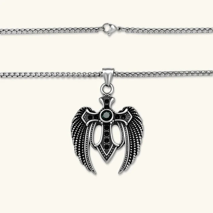 Dark Angel Wing Cross Necklace in oxidized silver-tone metal, with sculpted dotted black wings and a dark green center stone