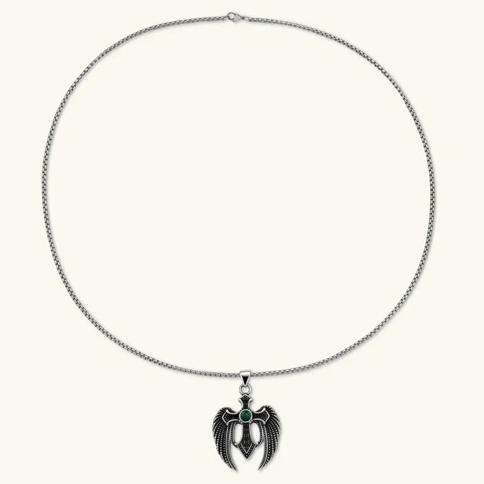 Dark Angel Wing Cross Necklace with a silver-tone chain and black sculpted wings framing a green stone cross pendant
