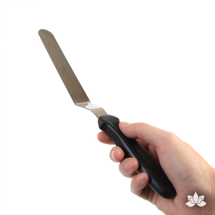 Offset Icing Spatula Stainless steel spatula used for cake decorating and spreading the icing on your cake.  A cake decorator's must have in the bakery or kitchen.