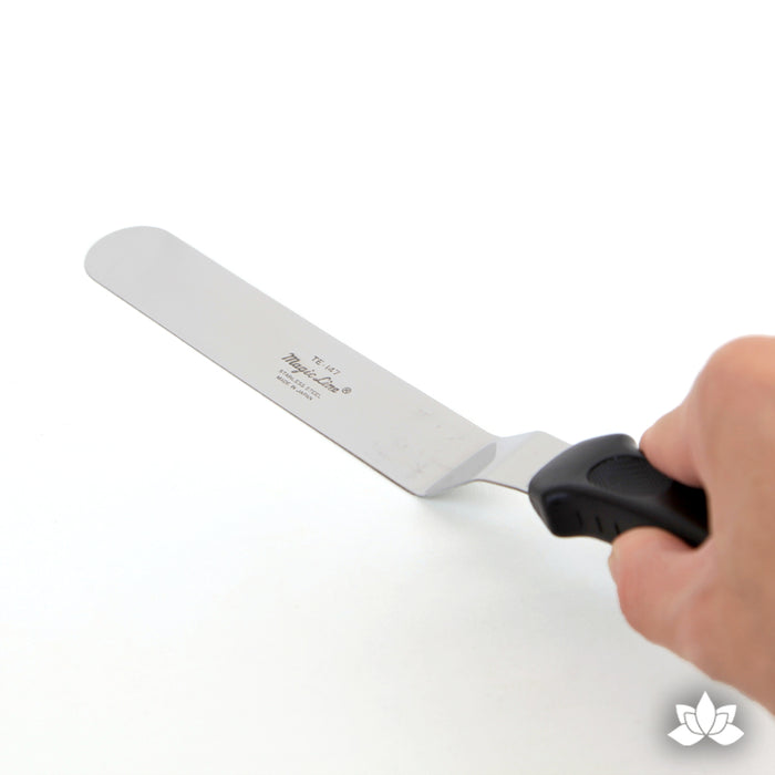 Offset Icing Spatula Stainless steel spatula used for cake decorating and spreading the icing on your cake.  A cake decorator's must have in the bakery or kitchen.
