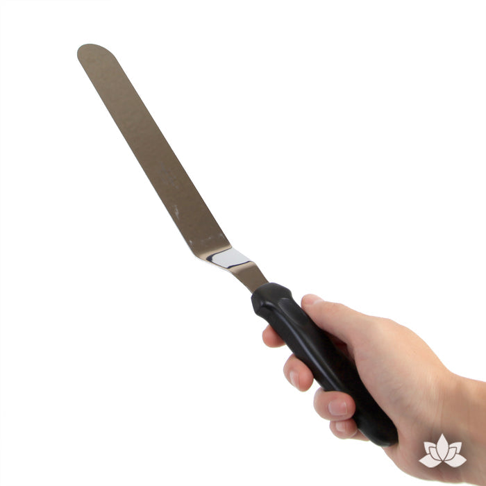 Offset Icing Spatula Stainless steel spatula used for cake decorating and spreading the icing on your cake.  A cake decorator's must have in the bakery or kitchen.