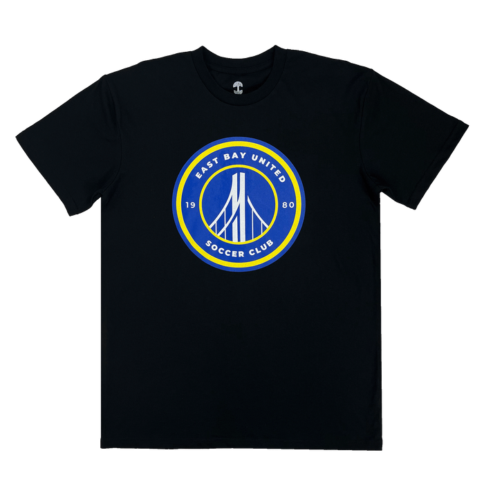 Front view of a black t-shirt with round blue, white, and yellow East Bay United Soccer Club 1980 logo on the front chest.