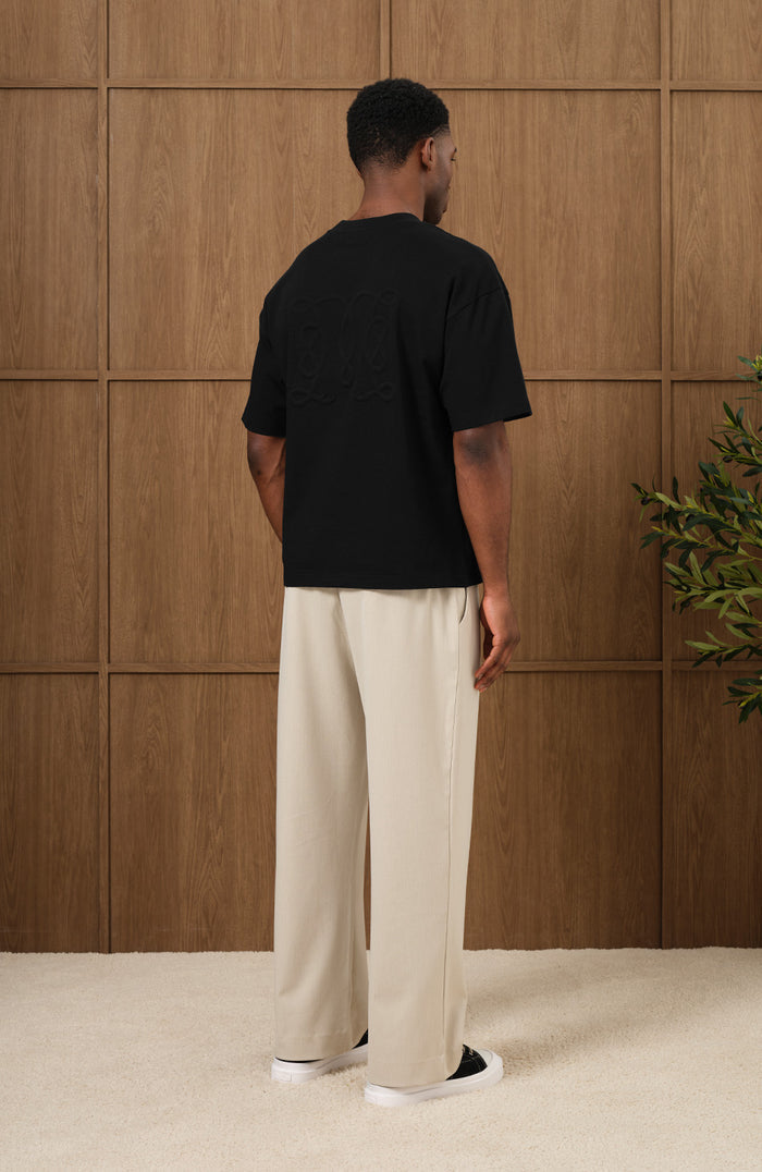 Embossed Monogram Back Logo T Shirt In Black