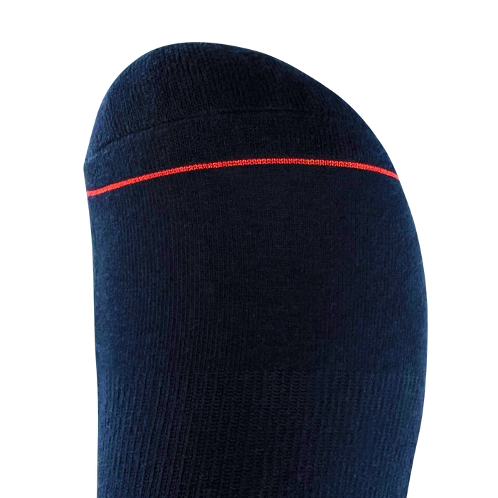 A close-up shot features an Embroidered Logo Sock by Oaklandish, showcasing a dark-colored sock enveloping a foot and highlighting the toe area. This crew sock is solid black with a fine horizontal red stripe near the toes and appears to have a subtly ribbed texture. Adorned with the iconic Oaklandish logo, these socks are available in adult sizes. The background is plain light grey, emphasizing the sleek design of the sock.