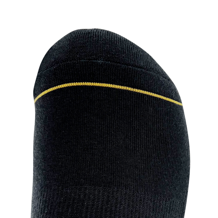Close-up view of the toe section of the black/gold Embroidered Logo Sock by Oaklandish, showcasing a seamless design. A single, subtle yellow line runs horizontally near the top edge, contrasting with the black fabric. The sock has a smooth knit texture and a slightly rounded shape at the tip. Available in adult sizes.