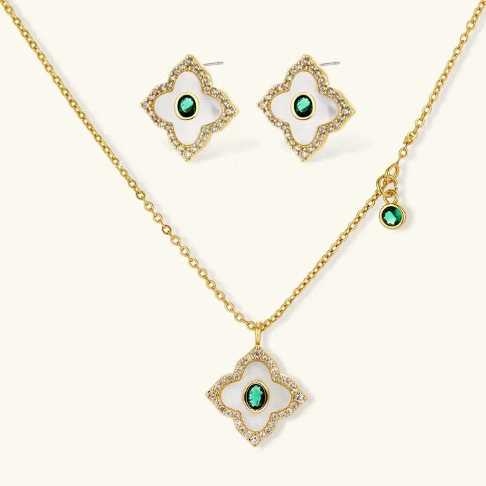 Emerald Bloom Clover Necklace set with gold-tone chain, white clover inlays, sparkling borders and green oval stones