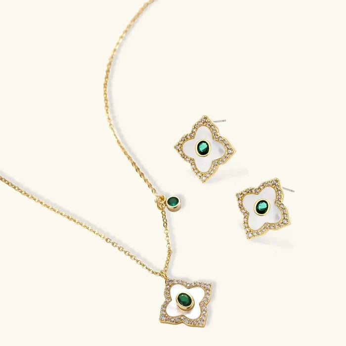 Emerald Bloom Clover Necklace with gold-tone clover pendant and matching earrings, white inlays, sparkling borders and green stones