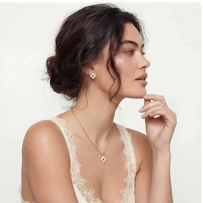 Emerald Bloom Clover Necklace with a gold-tone chain, green-centered clover pendant and matching clover stud earrings