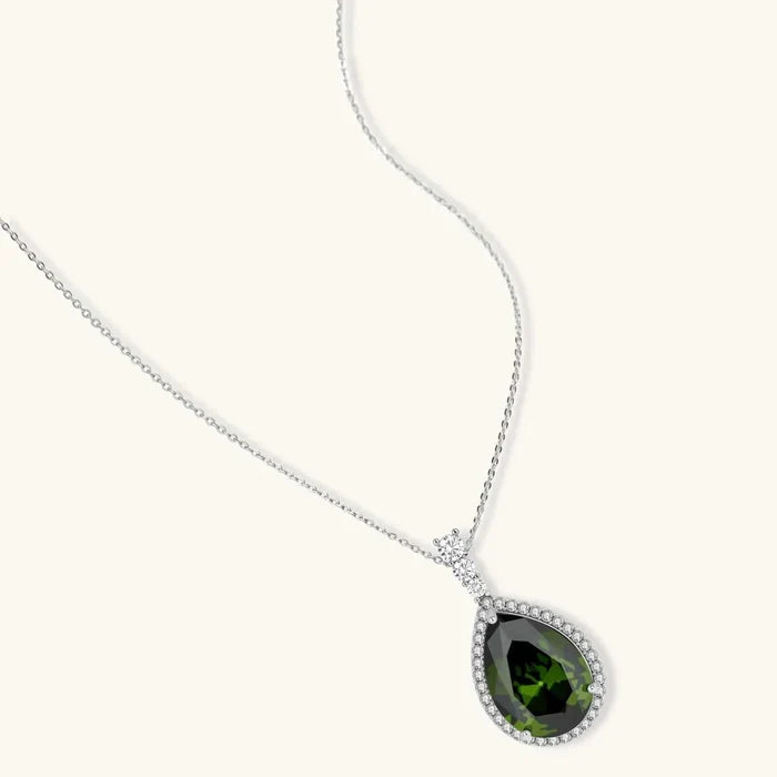 Emerald Dreams Green Zirconia 3-Piece Jewelry Set featuring a silver-tone chain necklace with a dark green pear-cut pendant and clear halo stones