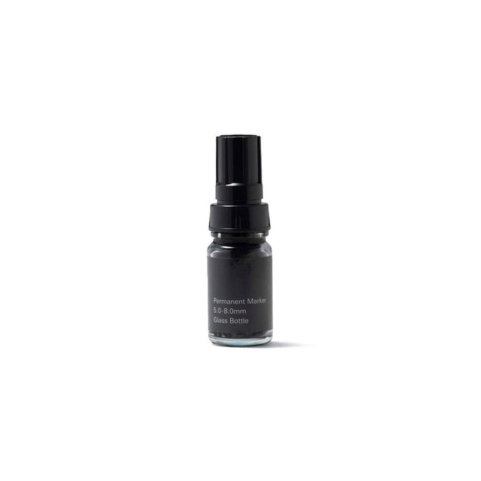 Black permanent marker bottle on a white background