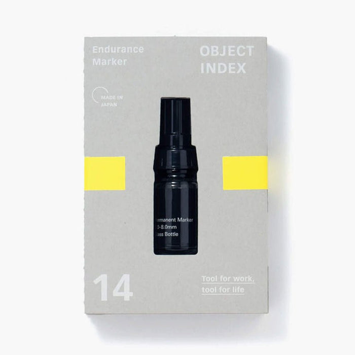Black marker bottle on a gray box with yellow accents