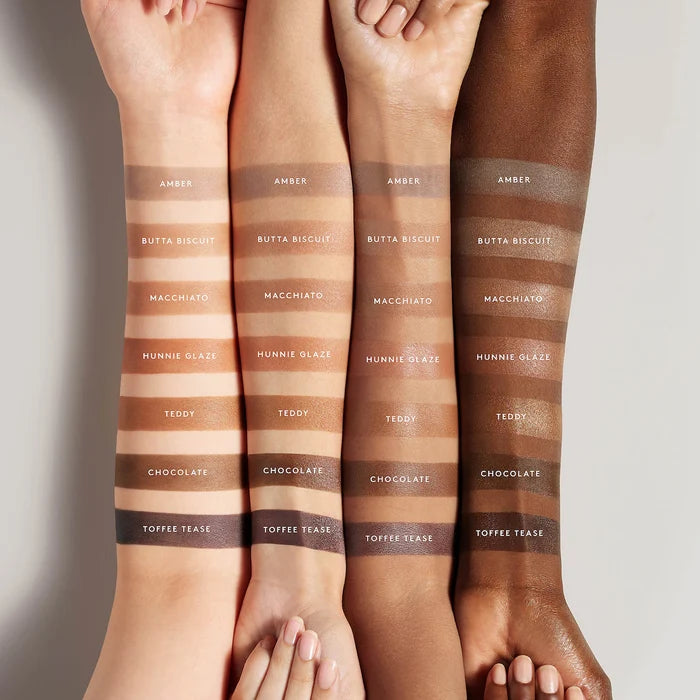 Fenty Beauty Cheeks Out Freestyle Cream Bronzer in various shades, featuring a close-up of the product packaging and swatches.