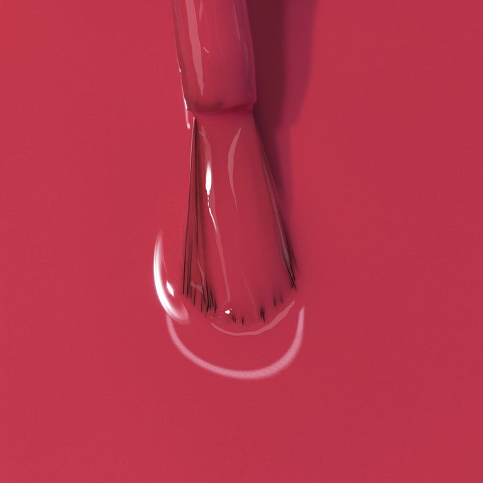 Close-up image of a brush applying LONDONTOWN's Flushed Cheeks nail polish.