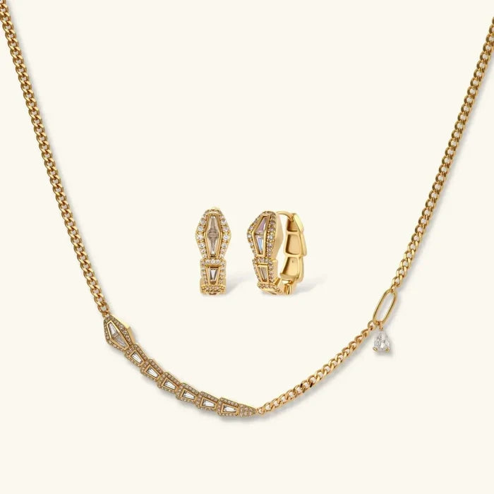 Geometric Luxe Snake Necklace set in gold-tone metal with geometric pavé accents, a clear drop, and matching huggie earrings