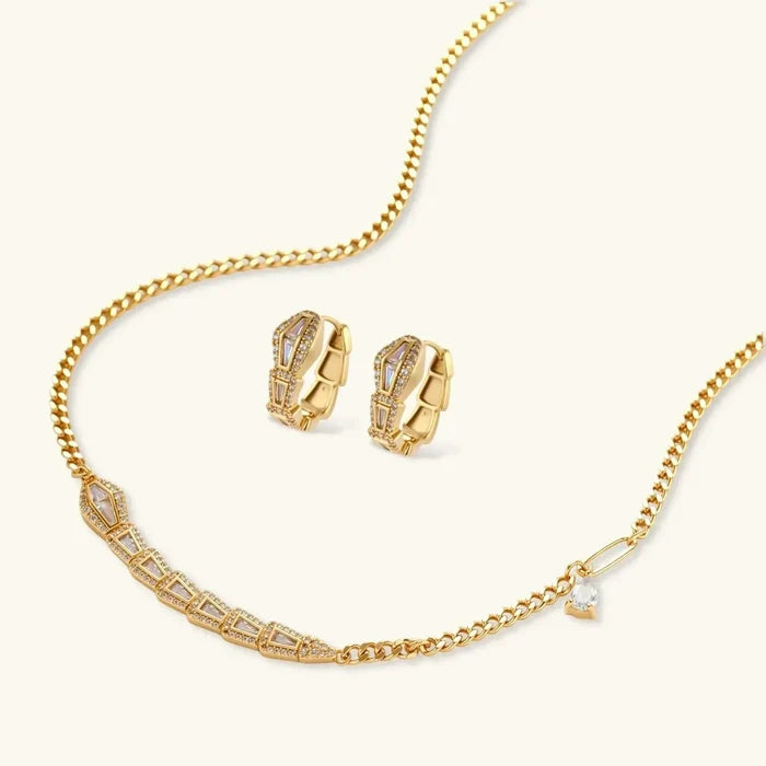 Geometric Luxe Snake Necklace gold-tone set with a segmented geometric snake pendant, clear stone accents and matching huggie earrings