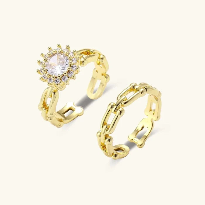 Golden Hour CZ Halo & Chain Ring Set with two gold-tone open chain bands, one sparkling round halo stone and one plain