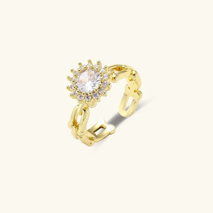 Golden Hour CZ Halo & Chain Ring Set shows a gold-tone open chain band with a round clear stone in a sparkling halo setting.