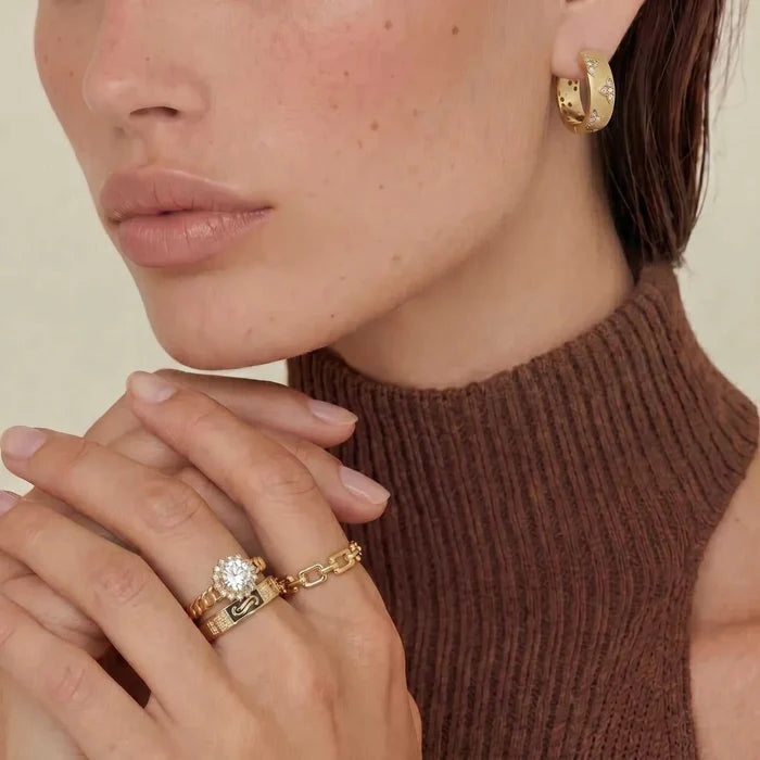 {"alt_text":"Golden Hour CZ Halo & Chain Ring Set features gold-tone chain bands, one topped with a sparkling round halo stone.","filename_slug":"golden-hour-cz-halo-chain-ring-set-gold-chain-halo-stone"}{"alt_text":"Golden Hour CZ Halo & Chain Ring Set features gold-tone chain bands, one topped with a sparkling round halo stone.","filename_slug":"golden-hour-cz-halo-chain-ring-set-gold-chain-halo-stone"}