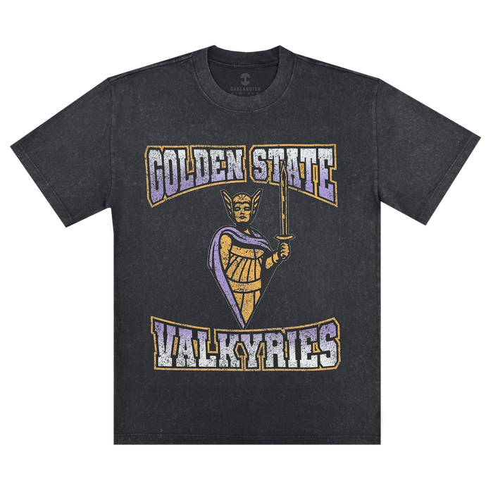 Show your support for the Golden State Valkyries in the GSV Guardian Stone Wash Heavy Tee—a 100% cotton, classic fit shirt with a female warrior graphic and "GOLDEN STATE" above and "VALKYRIES" below in gold, white, and purple.