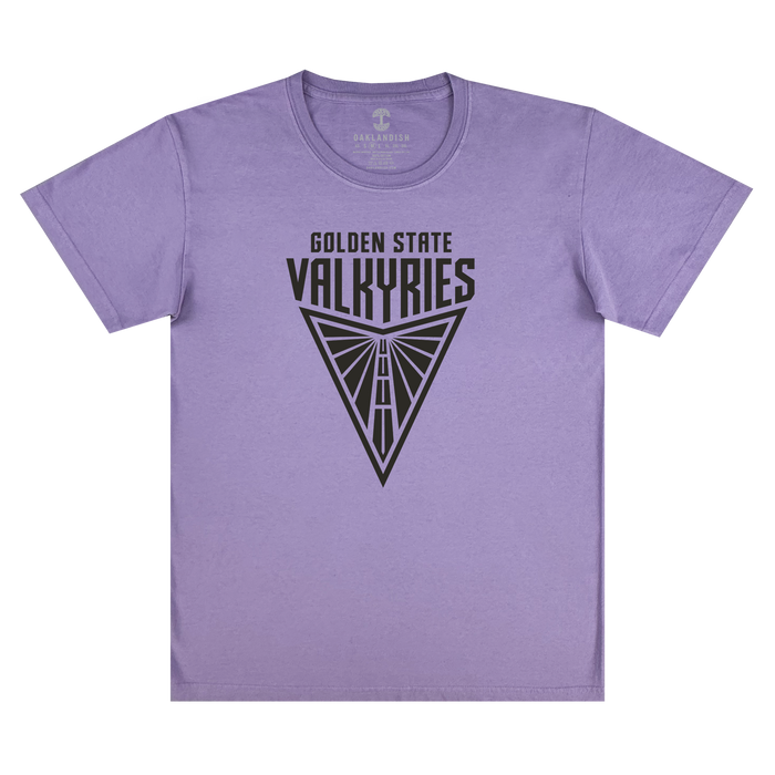 The GSV Golden State Valkyries Primary Premium Tee is a lavender, 100% cotton classic fit t-shirt featuring a black triangular emblem and "GOLDEN STATE VALKYRIES" above a stylized winged design inspired by the basketball team.