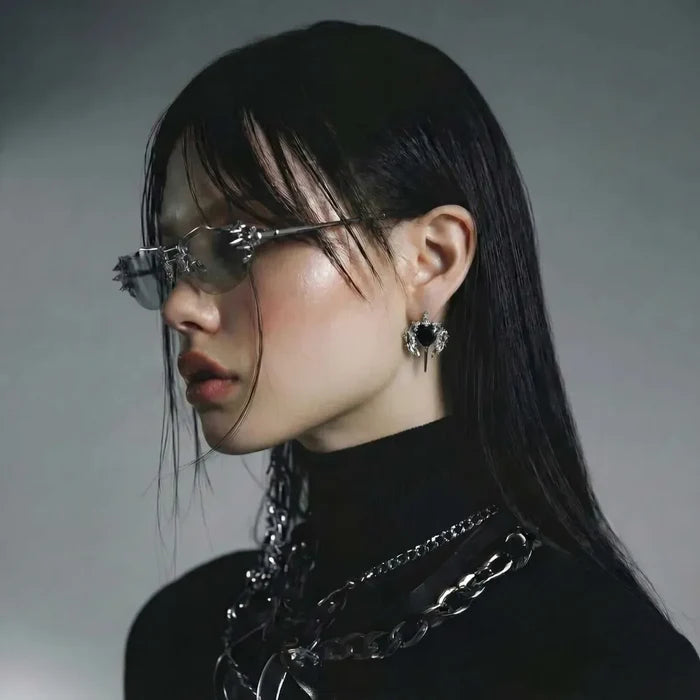 Gothic Black Heart stud earring in black with a faceted heart stone and silver-tone wing and dagger details