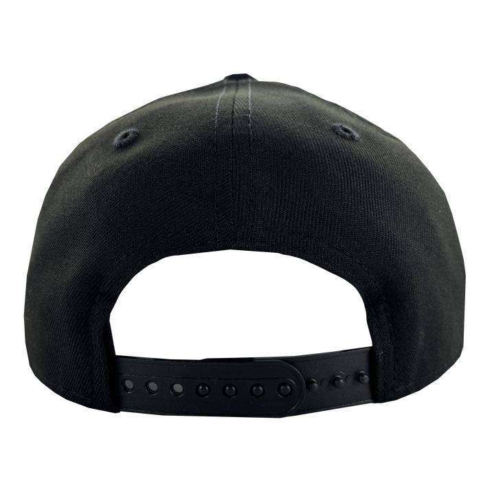 A close-up of the GSV Logo 9FORTY Snapback by GSV shows the black cap's plastic adjustable snapback strap and two stitched ventilation eyelets per side, set against a plain white background.