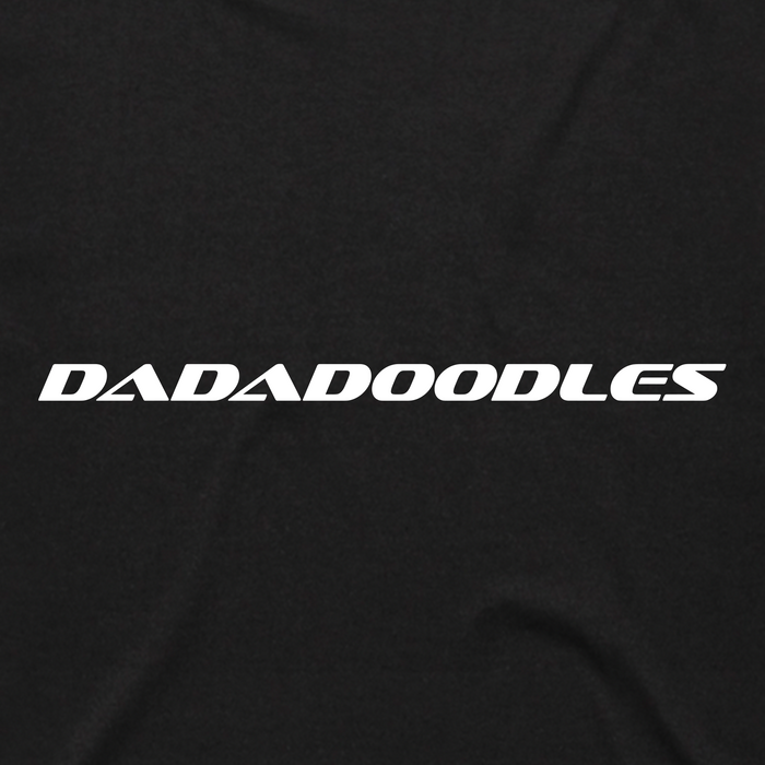White, bold, italicized text in an all-caps, modern font spelling “DADADOODLES” is centered on a black background. The surface beneath features subtle folds that hint at soft classic fit cotton fabric—just like your favorite Hammer into Time Tee from Other.