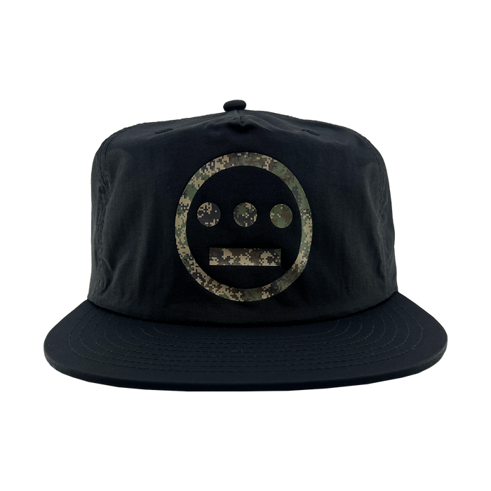 The Other Hiero Classic Camo Logo Hat is a black snapback cap with the iconic Hieroglyphics logo in green and brown camouflage on the front, set against a plain light gray background.