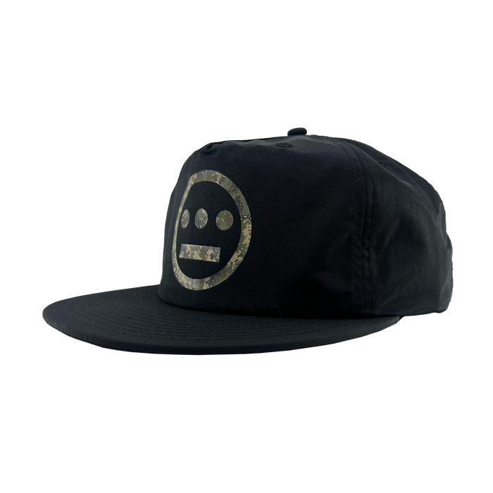 The Other Hiero Classic Camo Logo Hat is a black snapback with a flat brim, featuring a circular Hieroglyphics face logo in camo on the front—delivering hip-hop style that stands out against a plain white background.