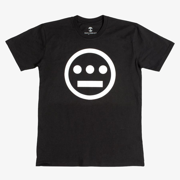 The Hiero Classic Logo Tee by Hieroglyphics is a black, classic fit T-shirt showcasing a simple, bold graphic on the front: a white circle with a horizontal line and three dots beneath it, evoking the iconic Hieroglyphics design. Featuring a crew neckline and short sleeves, this tee is displayed against a plain white background and is ideal for any hip-hop crew.