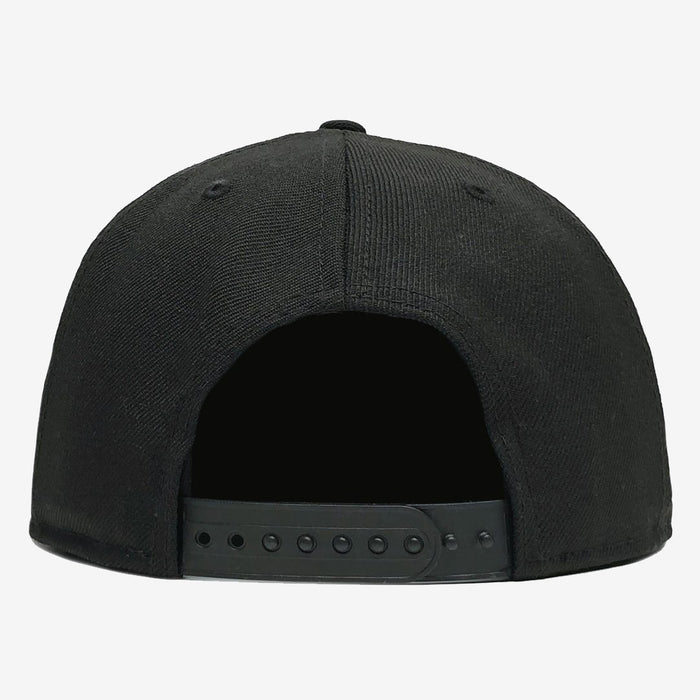 Rear view of the Hiero Crew Snapback by Hieroglyphics, a black baseball cap featuring a plastic snapback closure. This headwear has six panels and an arched opening at the back where the adjustable strap is fastened with multiple holes for size customization. The fabric appears textured, and the overall design is simple and solid-colored.