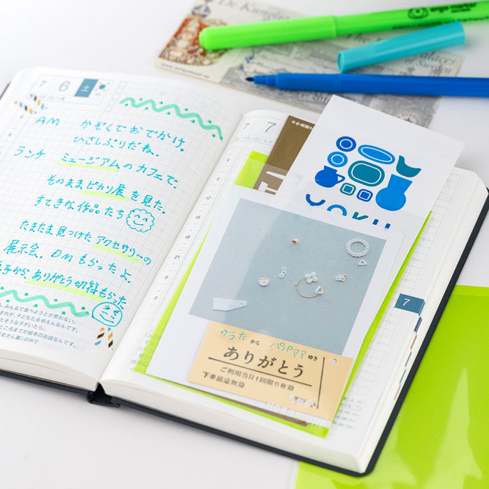 Hobonichi planner with accessories and stationery supplies