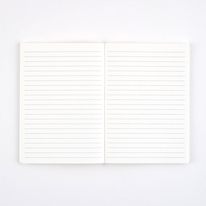 Open notebook with lined pages on white background