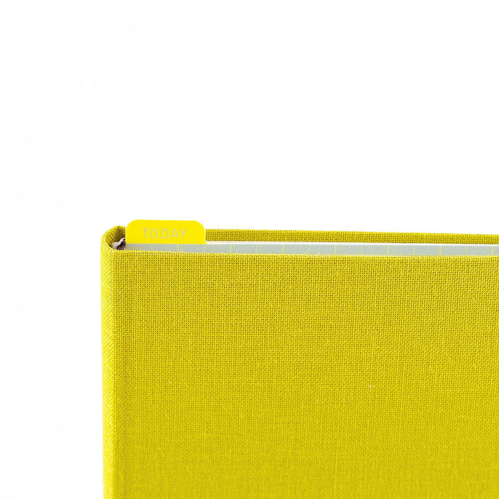 Weeks planner with pencil board "TODAY" tab peeking out against white background