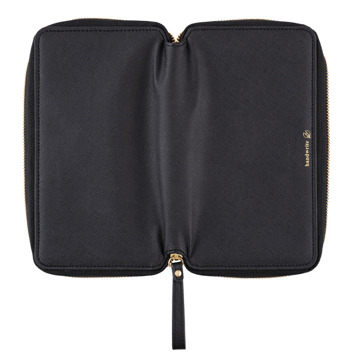 Black zippered fabric case open for Hobonichi Techo Weeks on white background