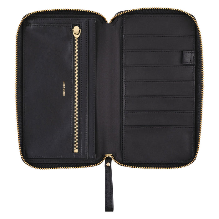 Black zippered fabric case open for Hobonichi Techo Weeks on white background