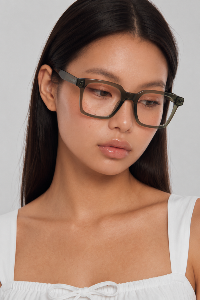 EyeCandys Hotshot Square Green clear lens glasses model shot featuring oversized green square frames with non-prescription clear lenses, trendy women's fashion eyewear, blue light style glasses for everyday wear, office outfits, minimalist fashion, and modern chic looks.